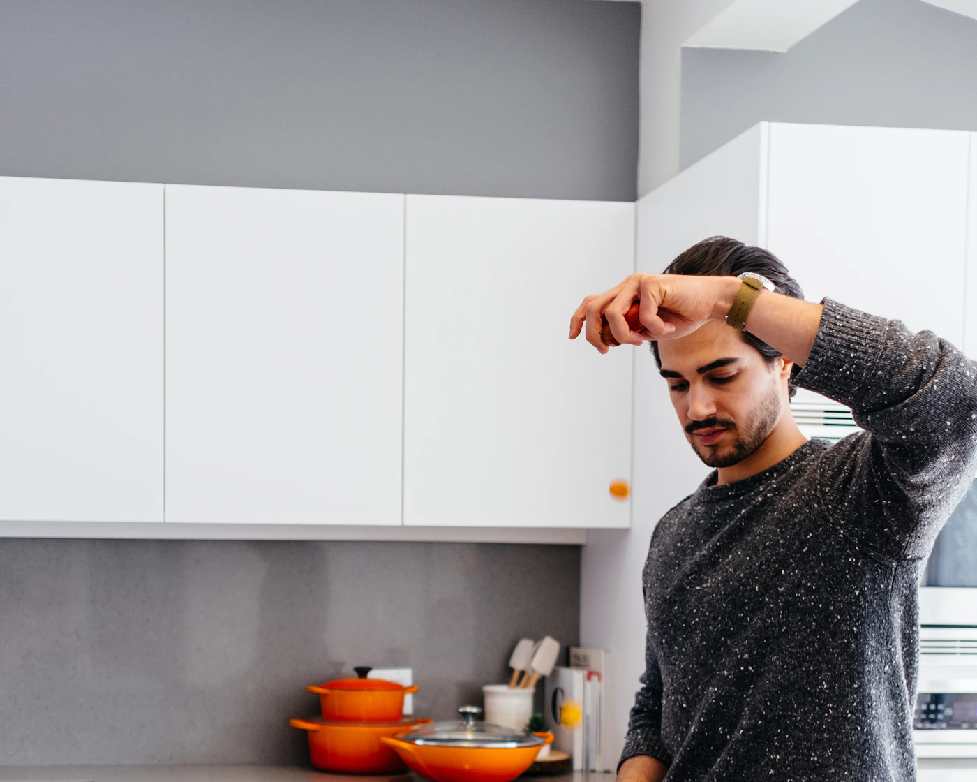 A person preparing food in a home kitchen